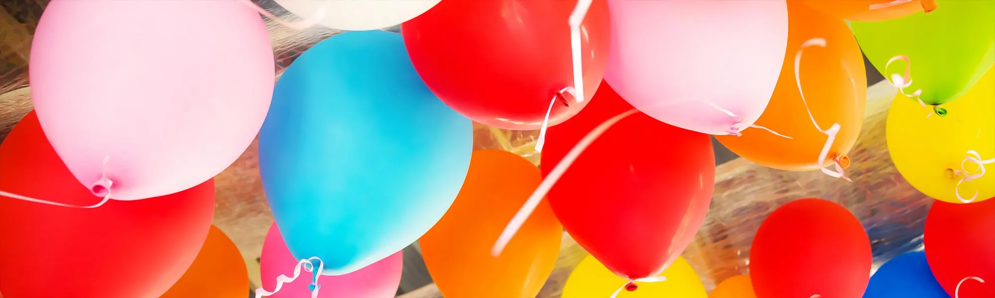 Close-up of a cluster of brightly coloured party balloons