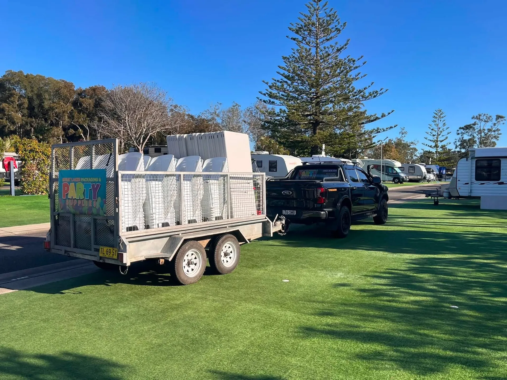Trailer loaded with folding tables and chairs ready for a local hire delivery
