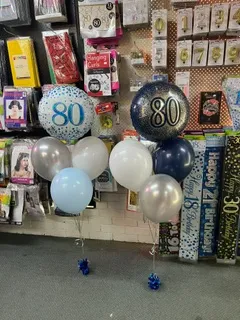 Number 80 foil balloons with a blue, silver and white balloon bouquet at our Tuncurry party supplies store