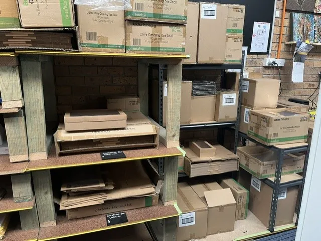 Shelves of catering boxes and food packaging in Tuncurry