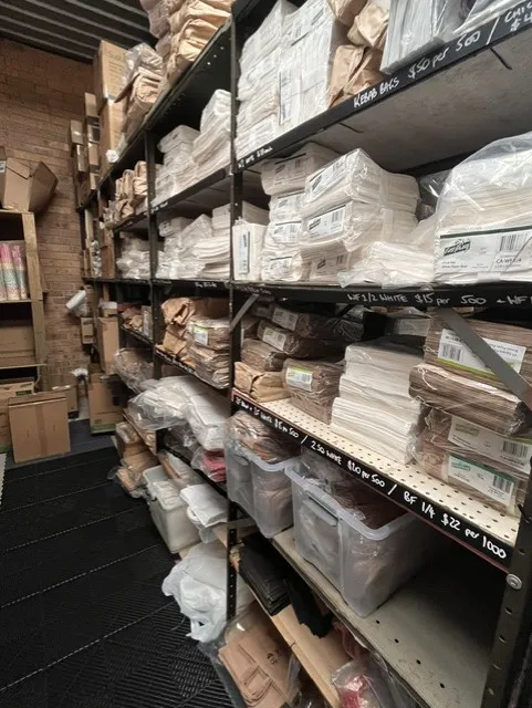 Paper bags stacked on the shelves at Great Lakes Packaging & Party Supplies